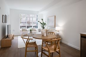 Langley apartment for rent - A modern dining room with a wooden table and chairs.