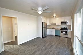 Concord apartment for rent - an empty kitchen with a ceiling fan and