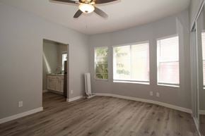 Oakland apartment for rent - a living room with wood floors and a ceiling fan