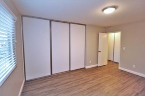 Oakland apartment for rent - an empty room with white closets and a window