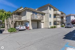 El Sobrante apartment for rent - an apartment building with two cars parked in front of it