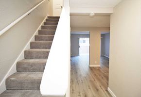 El Sobrante townhouse for rent - a view from the bottom of the stairs looking into the living room and dining room