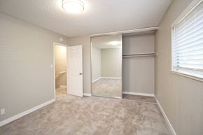 El Sobrante townhouse for rent - an empty bedroom with a closet and a door to a bathroom
