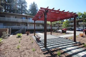 Lafayette apartment for rent - a covered area with a bench in front of a building