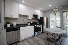 Lafayette apartment for rent - a kitchen with stainless steel appliances and a round table