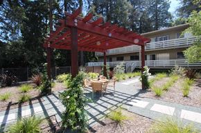 Lafayette apartment for rent - a patio with a table and chairs under a wooden pergola