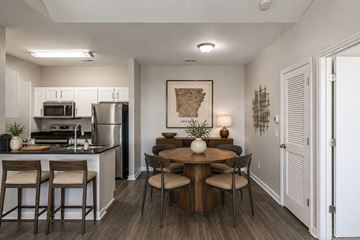 Fayetteville apartment for rent - A kitchen with a table and chairs in the middle of the room.
