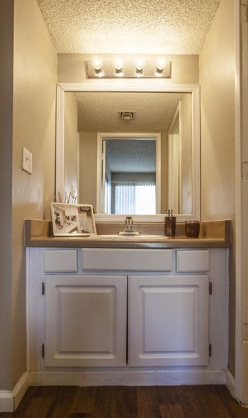 Bathroom vanity detached from bathroom, made for roommates