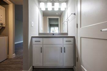 Bathroom vanity detached from bathroom, made for roommates