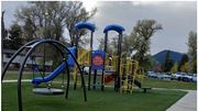 Livingston apartment for rent - A playground with a blue slide and yellow equipment.