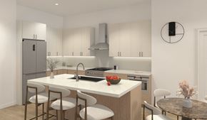 Cranford apartment for rent - A modern kitchen with a refrigerator, sink, and bar stools.