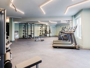 Plainfield apartment for rent - a gym with treadmills and other exercise equipment in a room with windows
