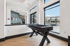 Corinth apartment for rent - A black pool table in a room with a view of the outside.