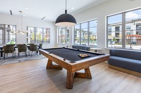 Burleson apartment for rent - A pool table in a room with a view of the city.