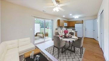 Davison apartment for rent - a living room and kitchen with a table and chairs