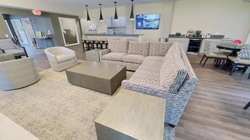 Shelby Twp apartment for rent - a living room with a couch and a table