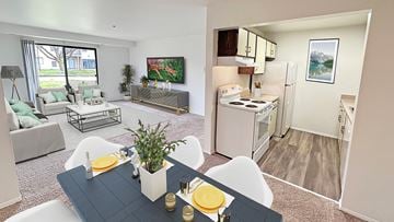 Canton apartment for rent - A modern living room with a dining table set for two.