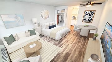 Toledo apartment for rent - A living room with a white couch and a wooden coffee table.