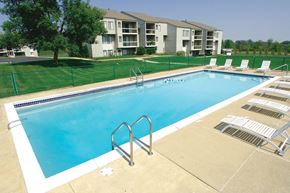 Kentwood apartment for rent - A swimming pool with a metal ladder in the middle of it.