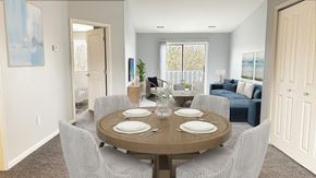 Howell apartment for rent - A dining room with a round table set for four.