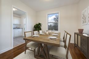 Dobbs Ferry apartment for rent - A dining room with a wooden table set for a meal.