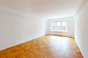 Forest Hills apartment for rent - A room with a window and wooden flooring.