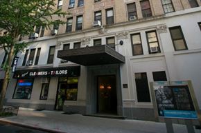 New York apartment for rent - A building with a sign that says "CLE INERS T'ILORS" on it.
