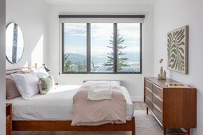 Park City apartment for rent - a bedroom with a bed and a window with a mountain view