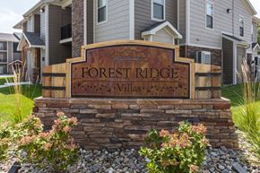 Kansas City apartment for rent - A sign that says Forest Ridge Villas in front of some houses.