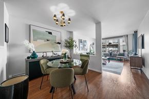 Halifax apartment for rent - A modern dining room with a wooden table and chairs.
