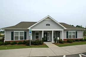 Goldsboro apartment for rent - A small building with the number 227 on the front.