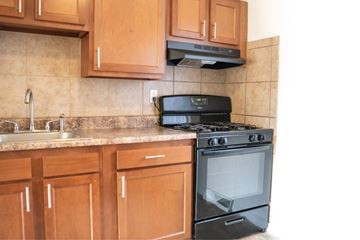 Overland apartment for rent - A black stove top oven sits on a kitchen counter.