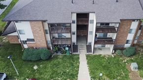Black Jack apartment for rent - A large apartment complex with a grassy courtyard in the front.