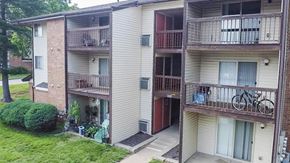 Black Jack apartment for rent - Apartment building with a bicycle on the balcony.