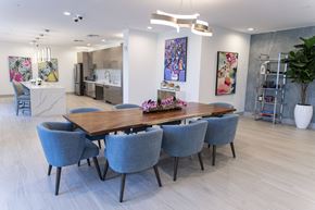 Hialeah apartment for rent - A dining room with a long table and chairs.