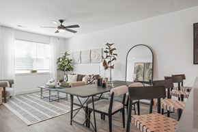 Knoxville townhouse for rent - A dining room with a table surrounded by chairs and a mirror on the wall.