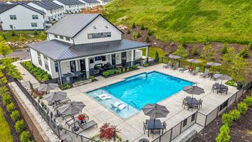 Knoxville townhouse for rent - A pool area with a building that has a sign that says "Steel Island".