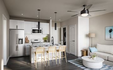 Orlando apartment for rent - A modern kitchen with a dining table and chairs.