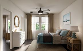 Orlando apartment for rent - A bedroom with a bed, dresser, and window with curtains.