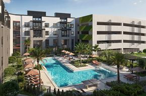Orlando apartment for rent - A modern building with a pool in front.