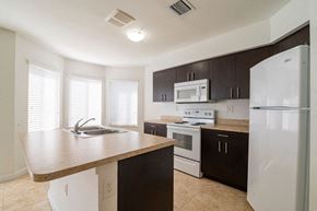 Homestead apartment for rent - a kitchen with a counter top and a refrigerator