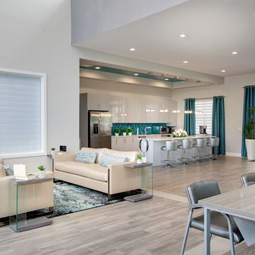 Miami apartment for rent - a living room with a couch and a kitchen with a table and chairs