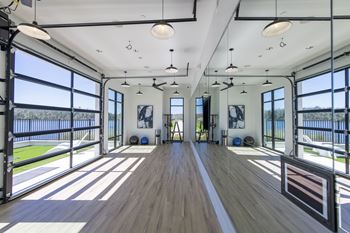 Lake side yoga studio with retractable garage door