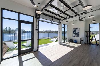 Lake side yoga studio with retractable garage door