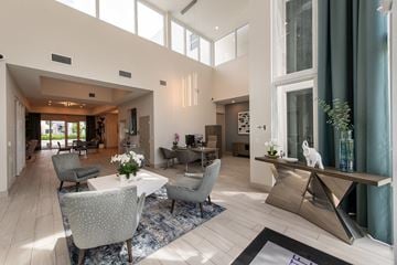 Miami apartment for rent - A modern living room with a dining table and chairs.
