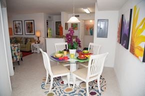 Pompano Beach apartment for rent - A dining room with a white table and chairs.