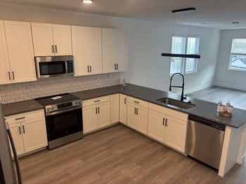 Open concept kitchen with island or bar
