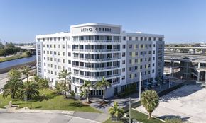 Hialeah apartment for rent - A white hotel with the name Arbo on the top.