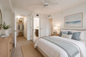Homestead apartment for rent - A bedroom with a large bed and a ceiling fan.