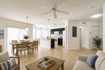 Homestead apartment for rent - A living room with a dining table and chairs.